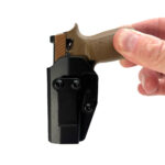 Product image: FingerholdingGoatGunsm17holster.jpg